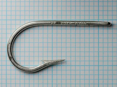 Pflueger Titan 10015T — full hook profile showing Sproat bend, tapered eye, and overall proportions — size 8/0 — hand-forged saltwater hook