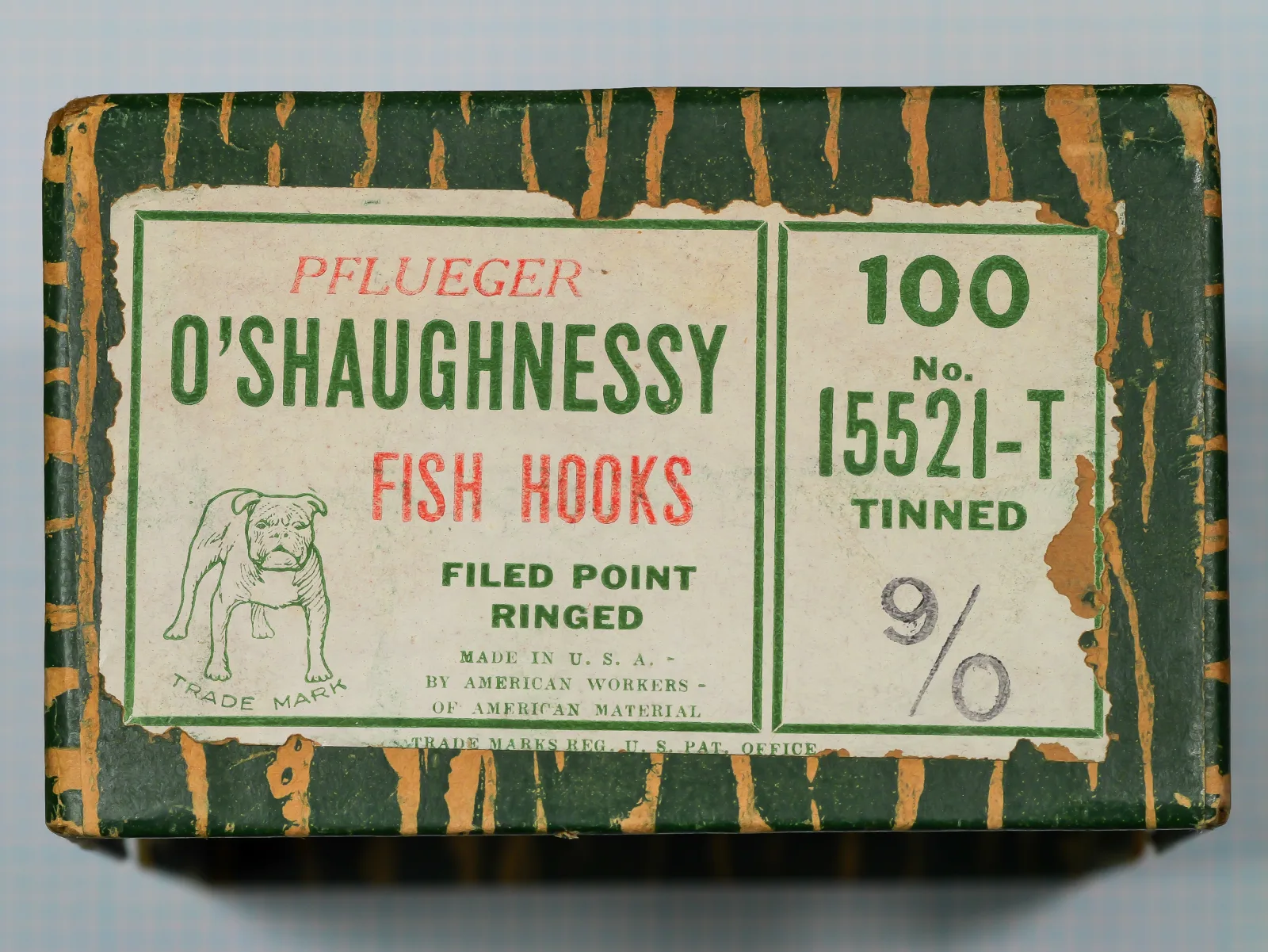 Pflueger O'Shaughnessy 15521-T — original factory box with green and cream label showing bulldog mascot and size 9/0 designation — vintage American bait hook package