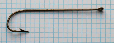 Pflueger Carlisle 3321-Br hook — full length profile showing overall proportions, shank length, gap width, and ringed eye construction — on 1/10-inch measurement grid — size 1/0