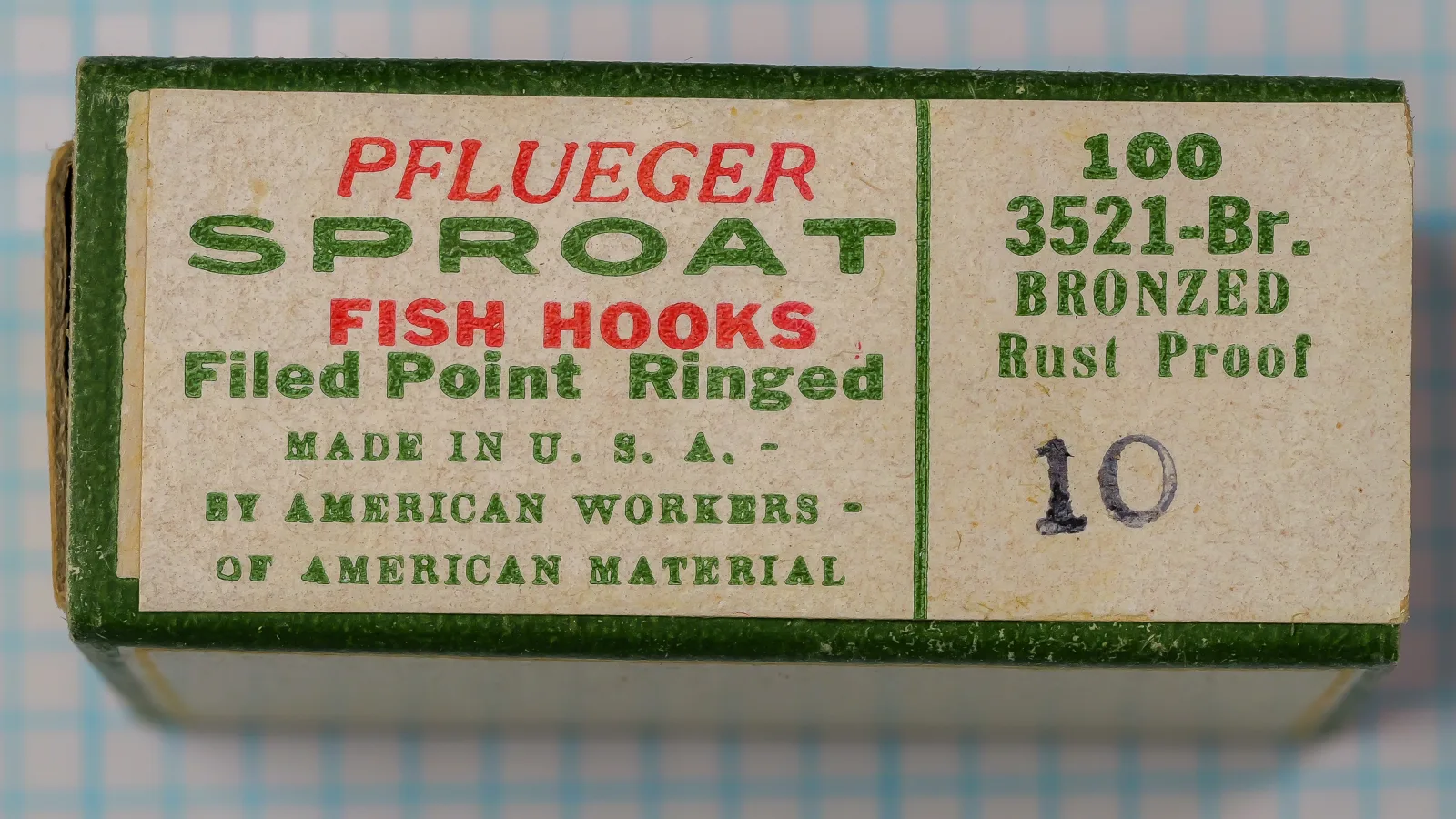 Pflueger Sproat 3521-Br No. 10 — packaging exterior showing green cardboard box with red and green letterpress typography, model code and specifications label on face, smaller retail format variant