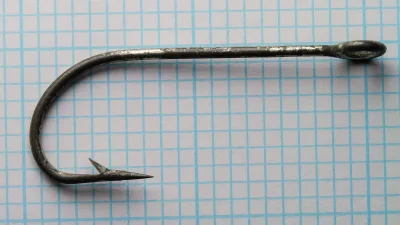 Pflueger 5212-T hook side profile — full hook length showing tapered eye, Limerick bend, and overall geometry at 6/0 size — measurement grid