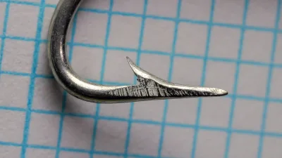 Pflueger Sheepshead Size 5 — side profile showing bend geometry, tinned finish, and point angle on measurement grid