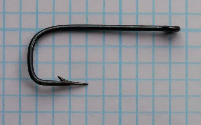 Turner & Sons Sneck Ringed hook — full profile showing straight ball eye, shank length, and complete bend geometry, size No. 10, japanned finish on measurement grid