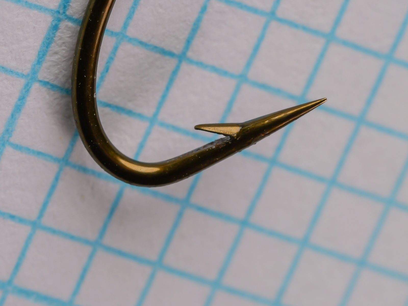Herters 707 English Bait Hook — close-up of hook point and barb — size 6 — hollow-ground point and ringed eye