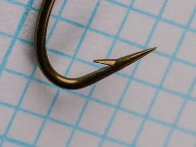 Herters 707 English Bait Hook — close-up of hook point and barb — size 6 — hollow-ground point and ringed eye