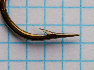 Mustad 9672 Size 2 — point profile detail — side angle — showing hollow-point geometry characteristic of the 9672 series