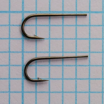 Partridge Round Taper Size 11 — front-facing hook views showing point geometry and barb placement