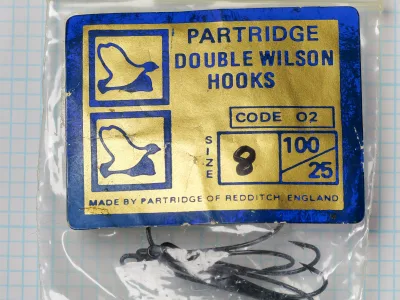 Partridge Code 02 Double Wilson — original tinplate-backed packaging card — blue and gold printed 'Made by Partridge of Redditch, England' — size 8, 25-hook quantity