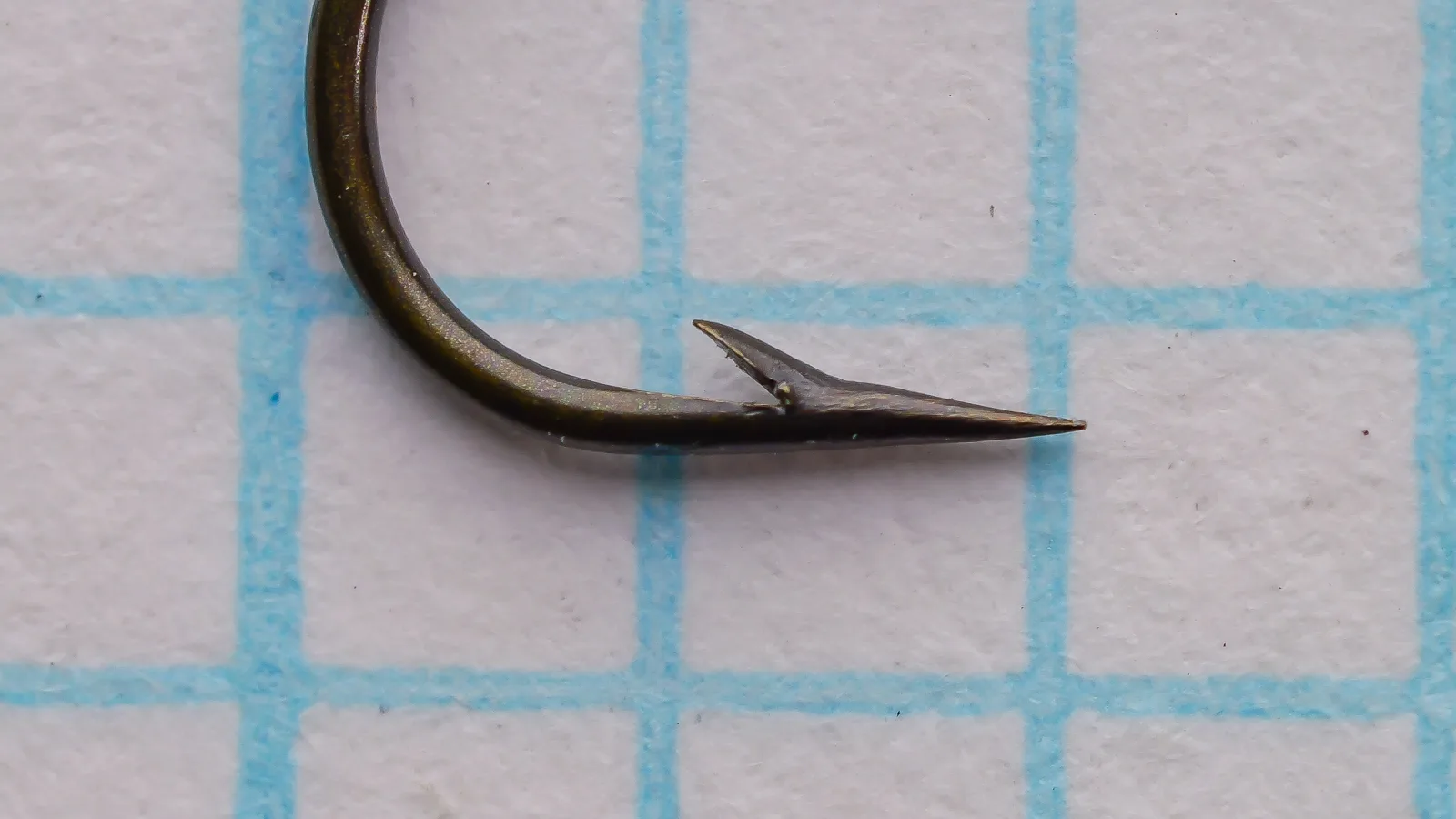 Partridge F.W. Round Taper — point and barb detail — size No. 9 — tapered blind eye visible from front face with bronze finish