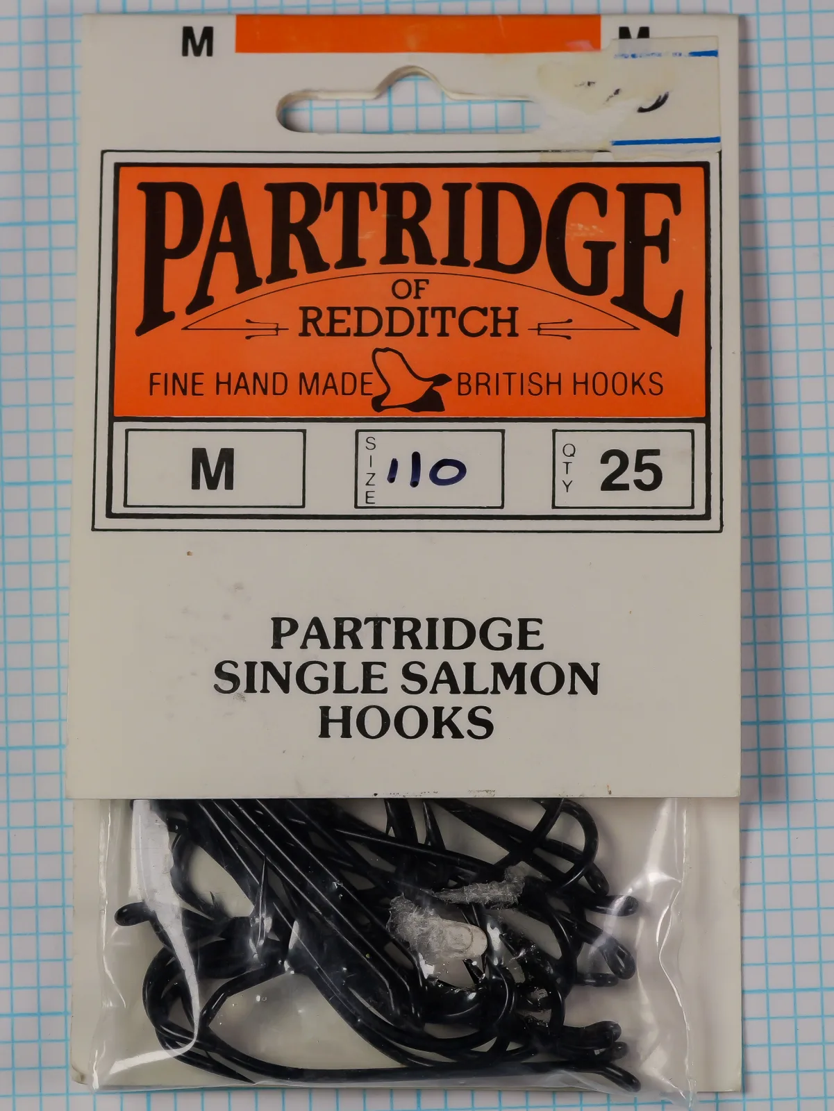 Partridge of Redditch card of Code M single salmon hooks, quantity 25, size written as 110