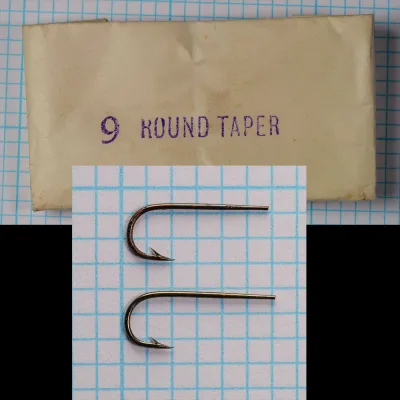 Partridge Round Taper Size 9 — two hooks overhead view on measurement grid — bronzed finish with visible aging