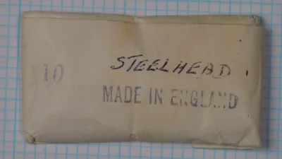 Vintage hook package label reading 'STEELHEAD' and 'MADE IN ENGLAND' with size 10 notation