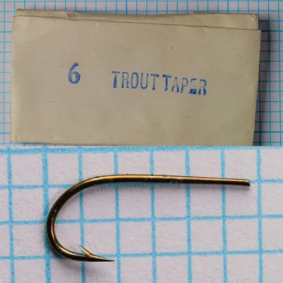 Partridge Trout Taper Size 6 — original kraft paper envelope front face — blue printed text on aged paper — measurement grid background