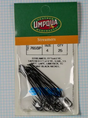 Tiemco TMC 765SP Streamer — clamshell package front showing Feather Umpqua Merchants branding and Size 4 qty 25 specification label with 25 black nickel hooks visible inside sealed packaging on measurement grid