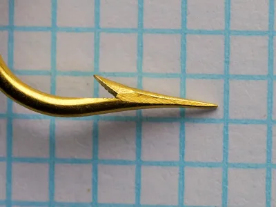 Mustad 3190 A Carlisle — point close-up showing Superior geometry — size 3/0 — gold-plated finish