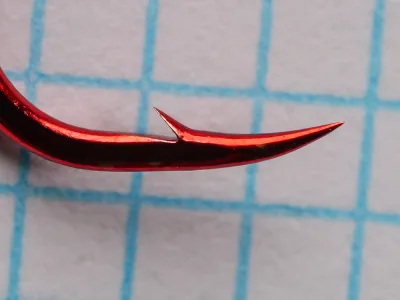 Gamakatsu 02308 Octopus Hook — close-up of point and barb — size 4 — red finish showing hollow point geometry