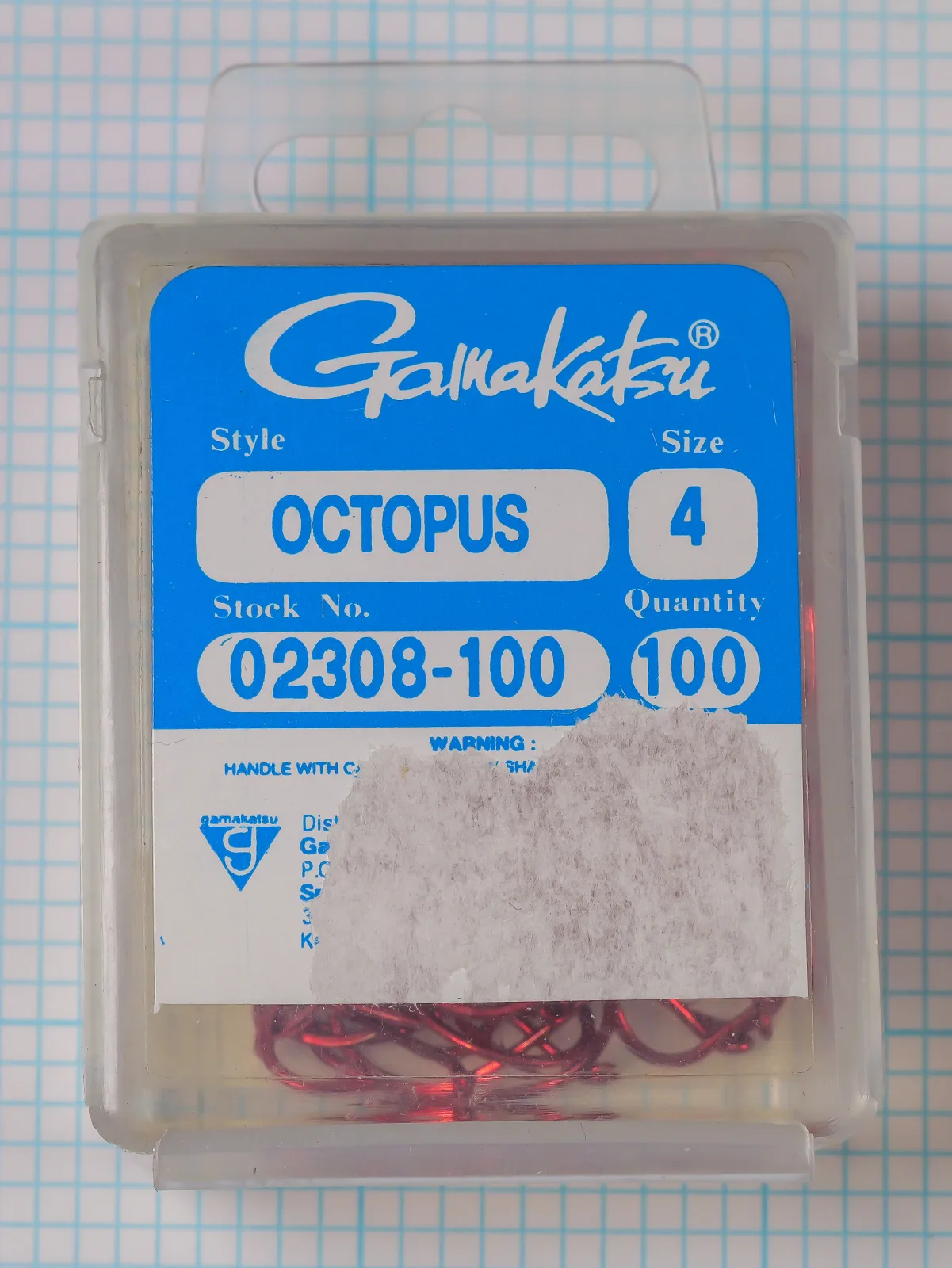 Gamakatsu 02308 Octopus Hook — packaging clamshell and header card — size 4 — red hooks visible through clear plastic