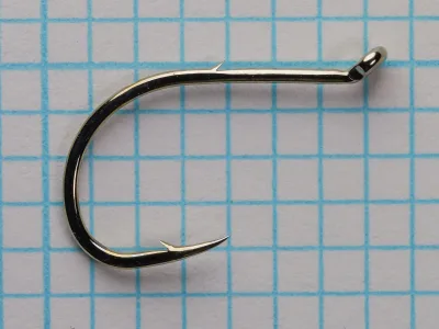 Gamakatsu 03008 Octopus — full hook profile showing bend, eye, and shank — size 4 — turned-up tapered eye on measurement grid