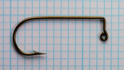 Mustad 32756 Aberdeen Hook — side profile showing jig eye, wide round bend, and bronzed finish — size 1/0 — on measurement grid