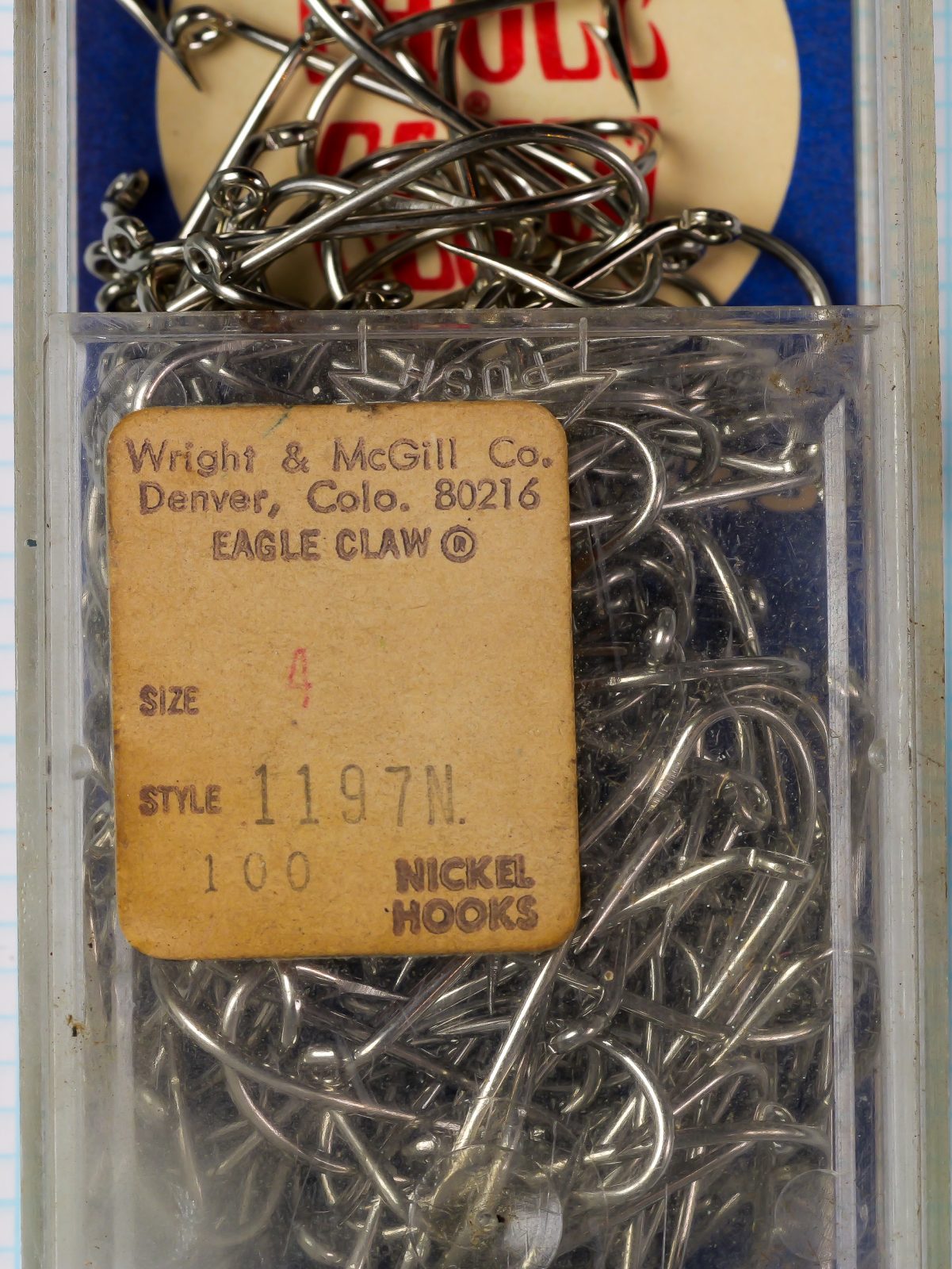 Eagle Claw 1197N Size 4 packaging — kraft paper label on clear clamshell with 100 hooks visible inside — Wright & McGill Denver address