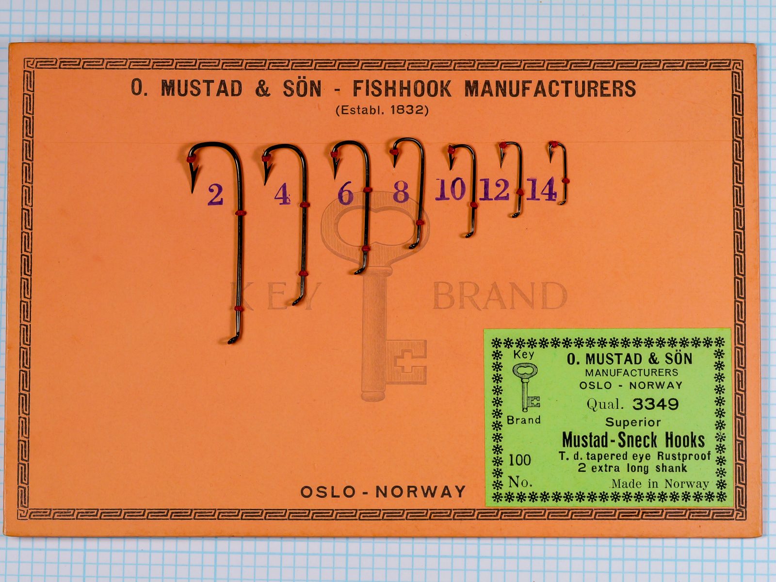 Mustad 3349 sales card full view — orange card variant with hook size display and embedded label — seven sizes on measurement grid