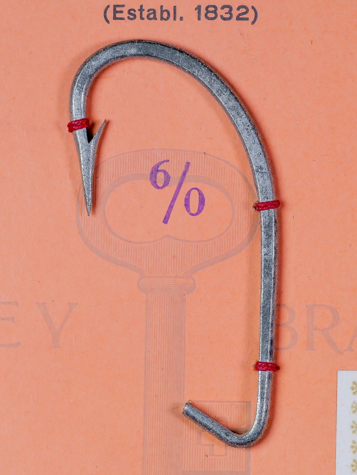 Mustad 7992-A O'Shaughnessy Hook — full hook profile side view — size 6/0 — eye, shank, and bend anatomy visible