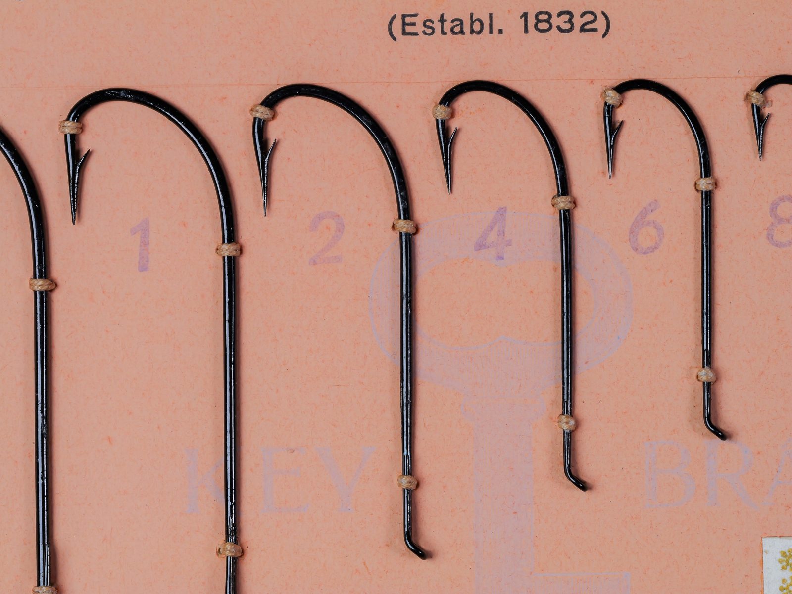 Mustad 9049 size 6 japanned limerick hooks on original sales card, numbered 1-6 visible, c. 1950s-1960s