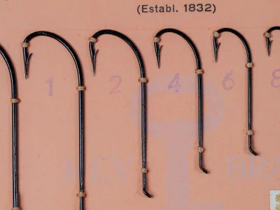 Mustad 9049 size 6 japanned limerick hooks on original sales card, numbered 1-6 visible, c. 1950s-1960s