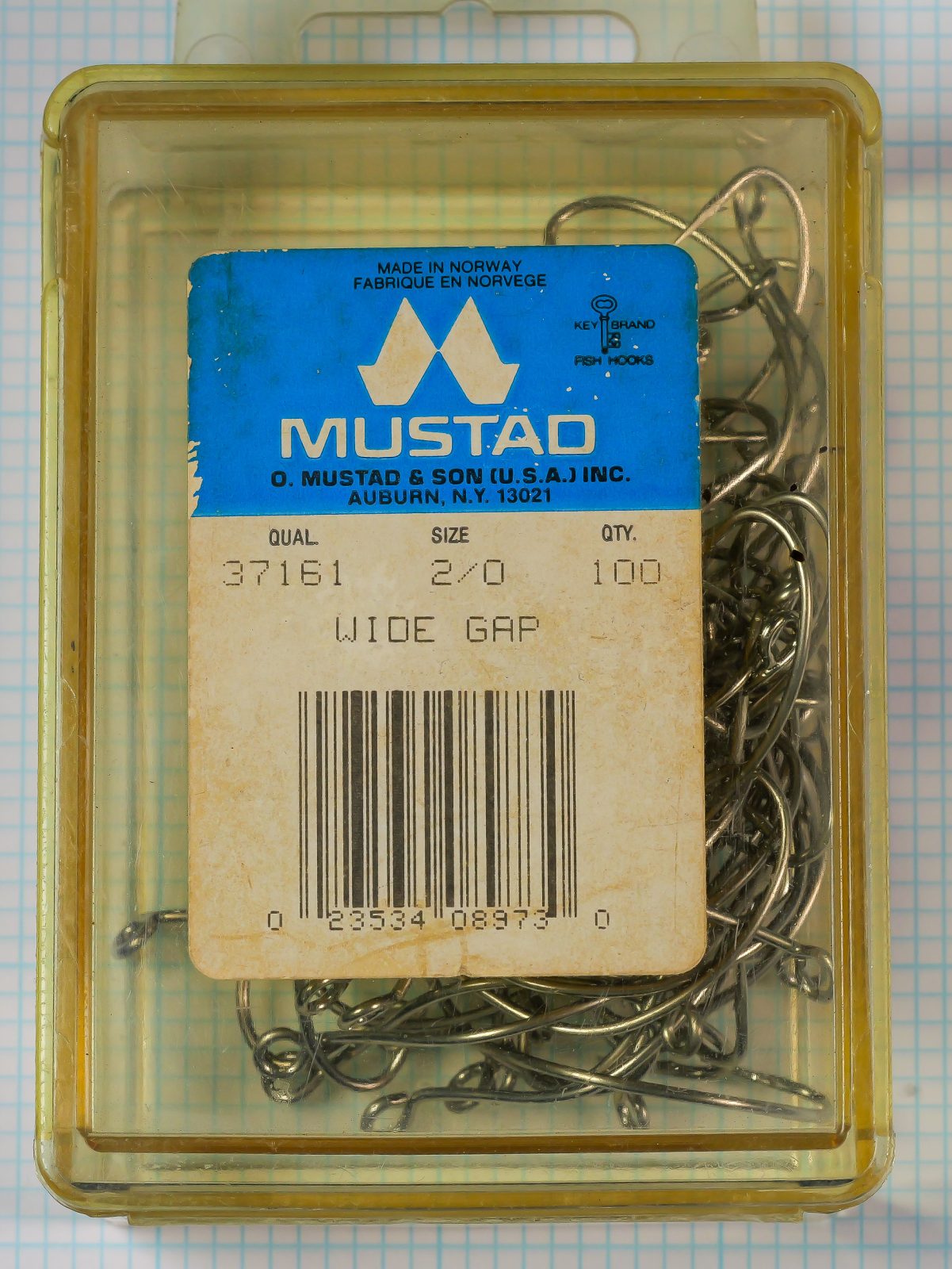 Mustad 37161 Wide Gap — vacuum-formed plastic box with printed label showing model, size, quantity, and Made in Norway marking — size 2/0 — 100-hook commercial package