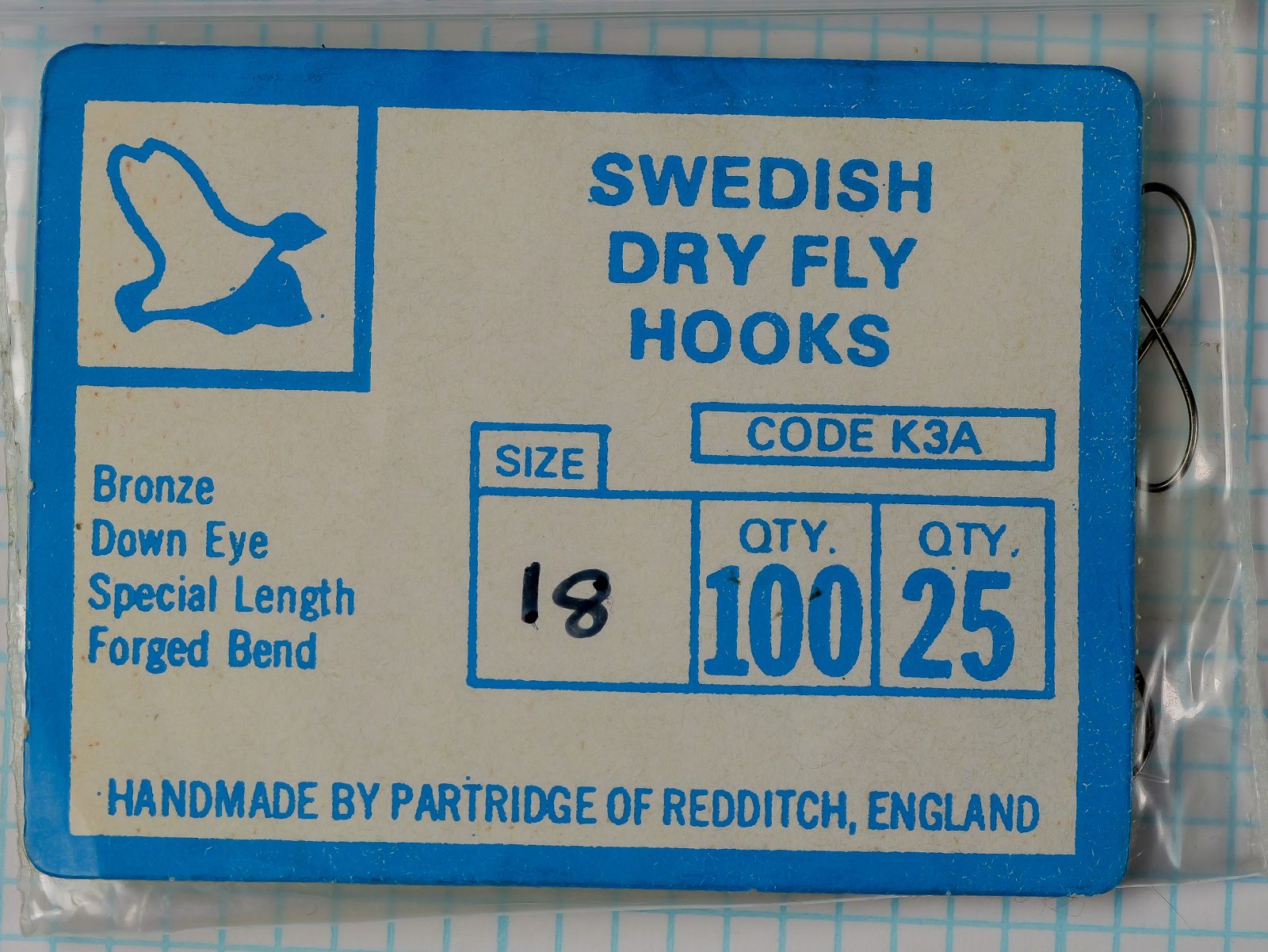 Partridge K3A Swedish Dry Fly Hooks — original manufacturer card front — size 18 — tan card with blue printed text and Partridge logo