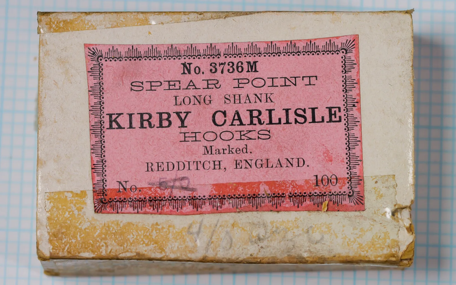 Allcock No. 3736M packaging — pink sales card with decorative border, printed text, scale ruler — indicating 100-hook quantity, Redditch manufacturer