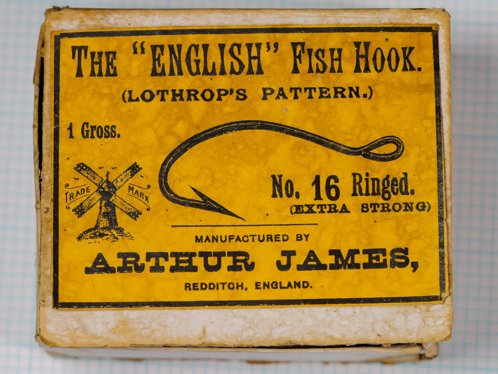 Arthur James vintage hook box label for Lothrops Pattern size 16, yellow with black text and windmill trademark.