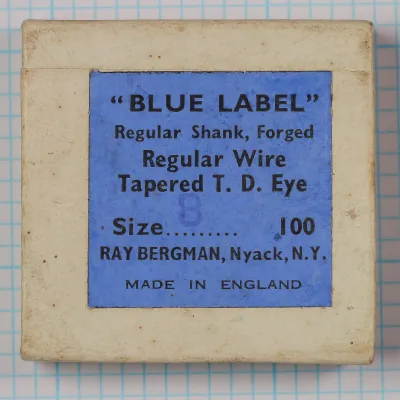 Blue Label hook box — printed label showing model specification and Ray Bergman attribution — size 8 — bronzed forged hook box