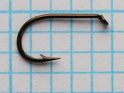Bergman Short Shank size 10 hook — side profile showing tapered turned-down eye, sproat bend, standard wire gauge, bronzed finish, point and barb detail