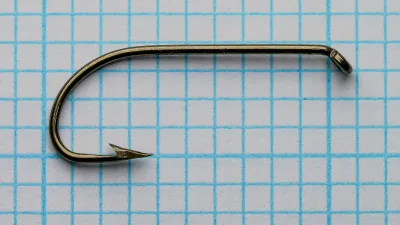Wright McGill Model 291 Sproat Bend — side profile of single hook on measurement grid — size 4 — bronzed finish with rounded bend profile