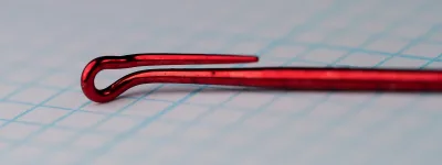 Red-finished T10-6H hook, tapered looped eye detail, side profile