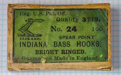 Milward Quality 3719 Indiana Bass Hook — original packaging label — size No. 24 — brass-frame card with green paper label, letterpress printing
