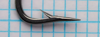 Milward 4095 O'Shaughnessy Hook — size 3/0 — side profile showing deep forged bend and ball eye — polished steel finish