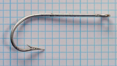 Mustad Cincinnati Bass Hooks size 20 — overhead view showing kirby offset direction — tinned wire — ball eye detail