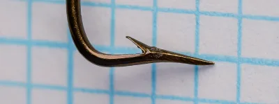 Mustad 3351 sneck hook profile view showing bend geometry and tapered eye