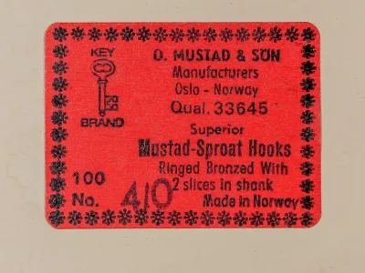Mustad 33645 — label detail showing text and hand-written inventory marks — red label stock — KEY BRAND logo
