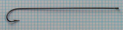 Mustad 3576 Size 2 hook full view on metric grid background showing overall proportions and shank length