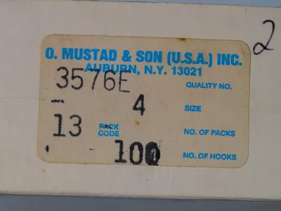 Mustad 3576E manufacturer box — label and packaging — original Auburn, N.Y. label with handwritten annotations — c. 1960-1975