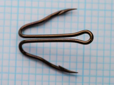 Mustad 35881 double live bait hooks shown as pair displaying ringed eye and hollow point