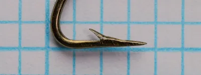 Mustad 36803 — side view of bend and point — hollow point geometry visible