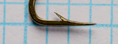 Mustad 36862 Limerick Hook — Close-up of bend and point geometry — No. 8 size — Hollow point construction visible from side