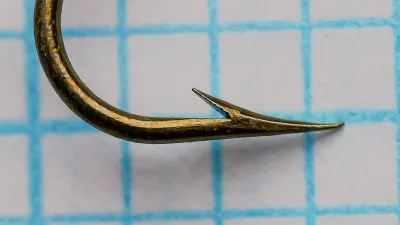 Mustad 3713 B Carlisle Hook — size 5 specimen, profile view showing blind marked shank terminus and hollow point