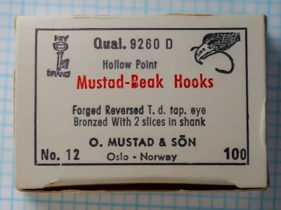 Mustad 9260 D Beak Hook — original manufacturer box with label, cream cardboard with black letterpress printing, size 12, 100-count pack, bronzed finish