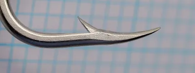Mustad 92618 Beak Hook, size 9/0 — angled side view showing reversed-offset bend geometry, extra-long shank, and nickelled finish