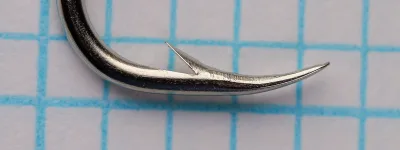Mustad 94181 size 3 hook — side view showing bend profile and point geometry — nickelplated finish